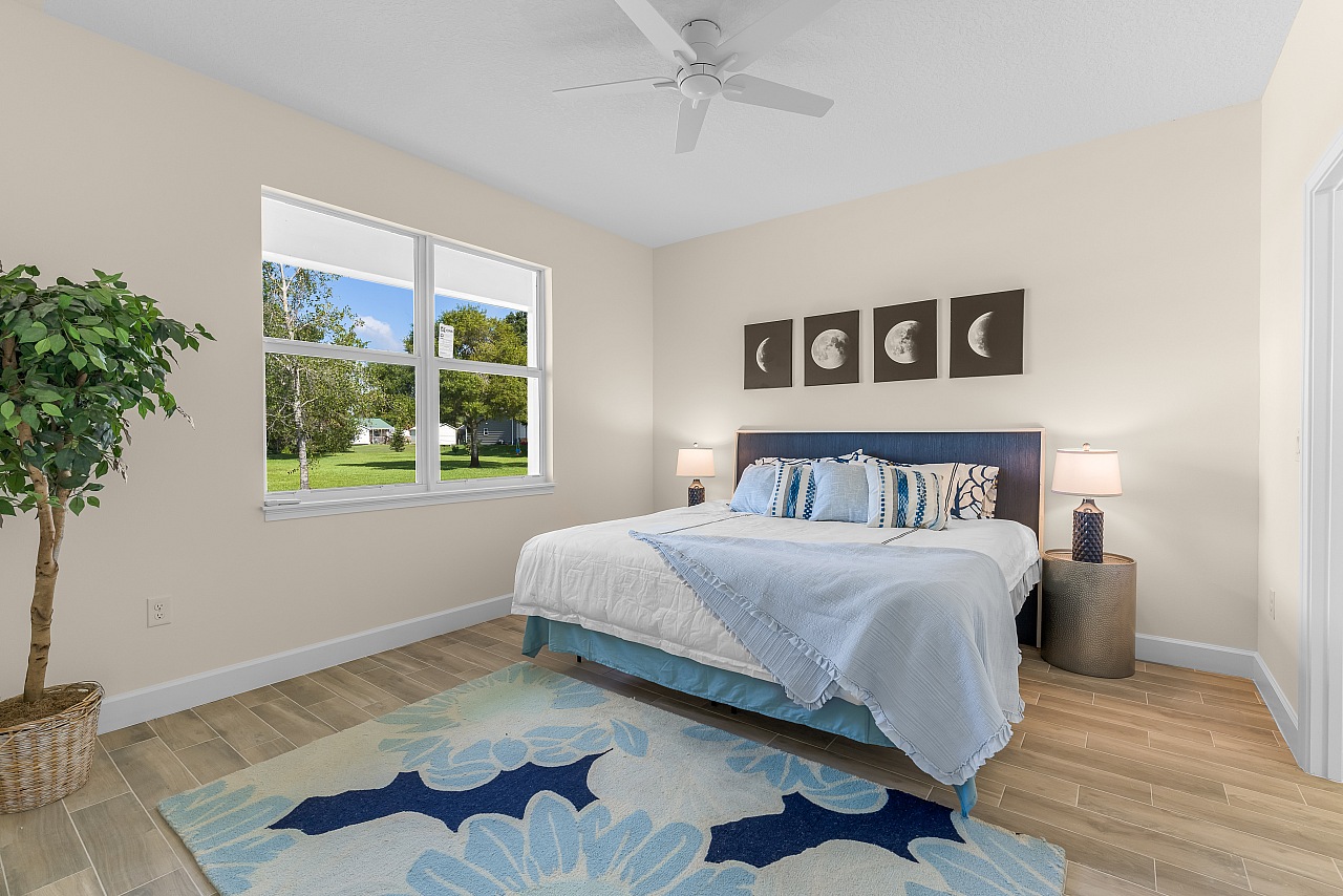 Staged primary bedroom in an Osuna Homes model